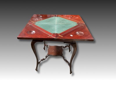 Lot 858 - A 19th century mahogany envelope games table...