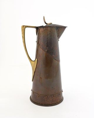 Lot 171 - An Arts and Crafts copper and brass jug,...