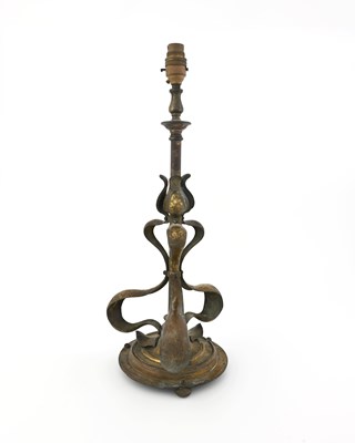 Lot 197 - An Arts and Crafts gilt brass table lamp, in...
