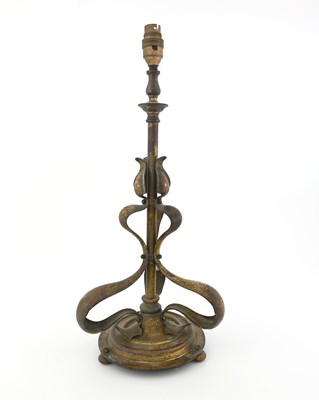 Lot 197 - An Arts and Crafts gilt brass table lamp, in...