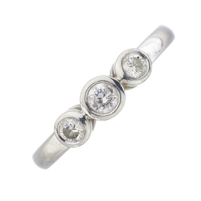 Lot 180 - An 18ct gold diamond three-stone ring