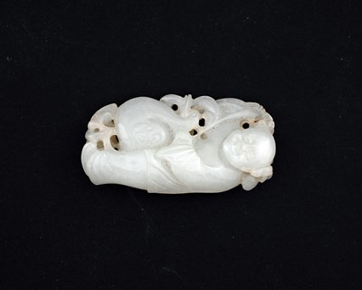 Lot 396 - A Chinese carved jade pendant, modelled in...