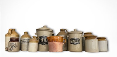 Lot 161 - A collection of stoneware vessels and food...