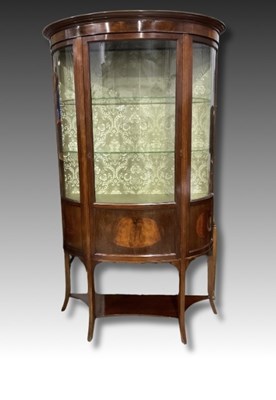 Lot 878 - A strung Edwardian mahogany bow fronted glass...