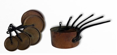 Lot 365 - A set of French graduated copper saucepans...