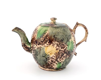 Lot 749 - A Whieldon sprigged teapot, circa 1740,...