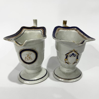 Lot 254 - Two near-matching Chinese export creamers or...