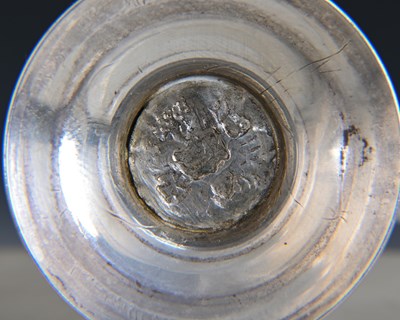 Lot 298 - An unascribed silver-coloured metal caster, of...