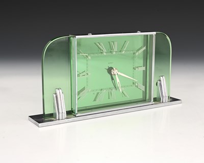 Lot 199 - An Art Deco chrome and green glass clock,...