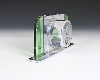 Lot 199 - An Art Deco chrome and green glass clock,...