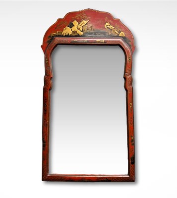 Lot 983 - A chinoiserie red lacquer parcel gilt mirror...