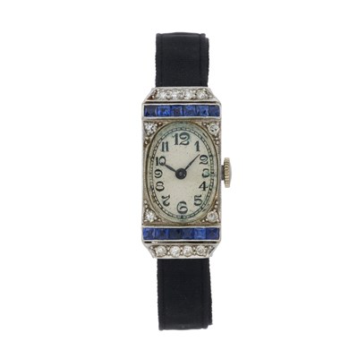 Lot 257 - An 18k gold diamond and sapphire set cocktail watch