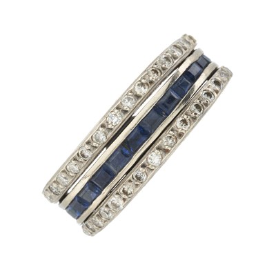 Lot 164 - An Art Deco diamond, sapphire and emerald full eternity flip ring