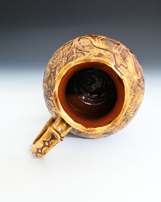 Lot 757 - An English slipware jug, sgraffito decorated...