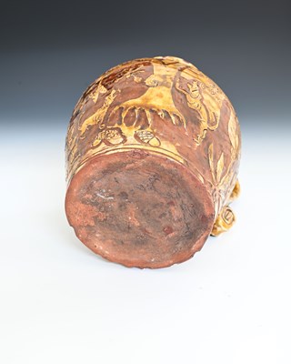 Lot 757 - An English slipware jug, sgraffito decorated...