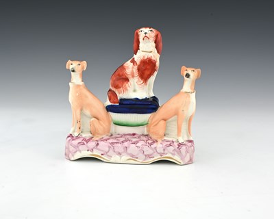 Lot 766 - A Staffordshire pottery figure group of three...