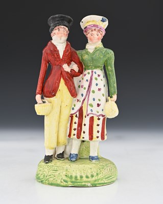 Lot 755 - A Staffordshire pottery pearlware figure of...