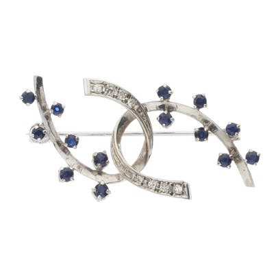 Lot 176 - An 18ct gold sapphire and diamond scroll brooch