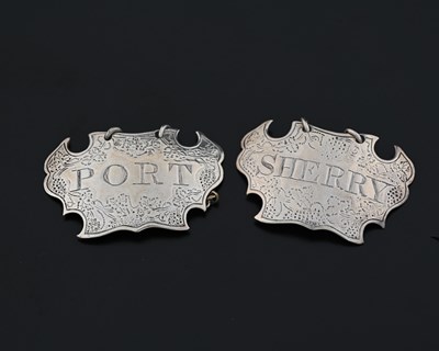 Lot 161 - A pair of George III silver wine labels or...