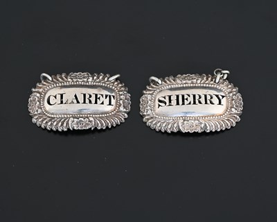 Lot 170 - A pair of George IV Regency silver wine labels...