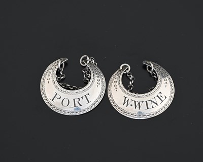 Lot 172 - A pair of George III silver crescent wine...