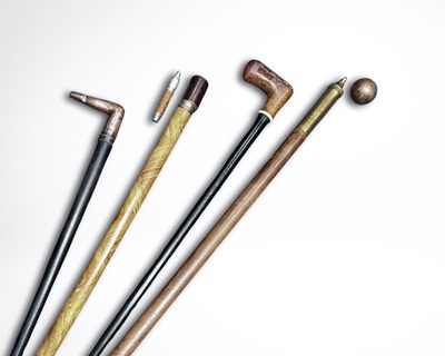 Lot 565 - A collection of smoking system walking sticks,...