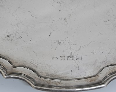 Lot 74 - An Elizabeth II silver salver, modelled after...