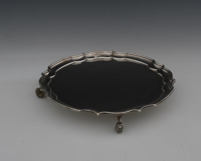 Lot 74 - An Elizabeth II silver salver, modelled after...