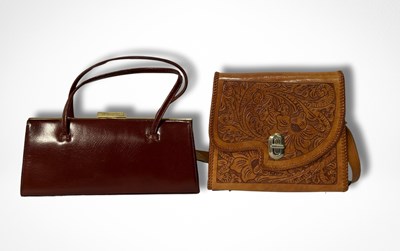 Lot 422 - Two vintage leather handbags, one in burgundy...