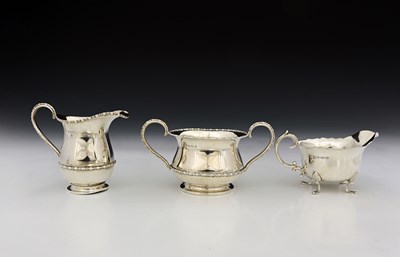 Lot 73 - A George V silver strawberry set, comprising...