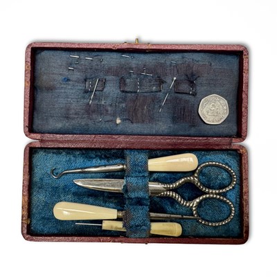 Lot 327 - A Victorian sewing kit, steel and bone...