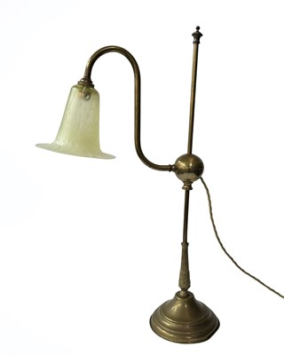 Lot 825 - A late 19th century brass table lamp on a...