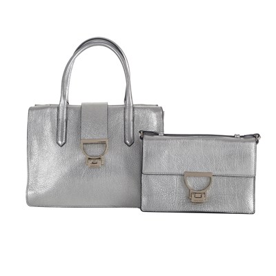 Lot 356 - Coccinelle, two silver leather crossbody handbags