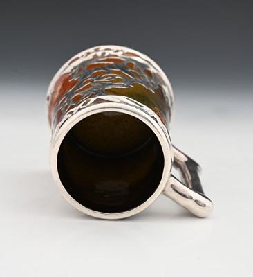 Lot 136 - A silver overlay ceramic tankard, J B Owens,...