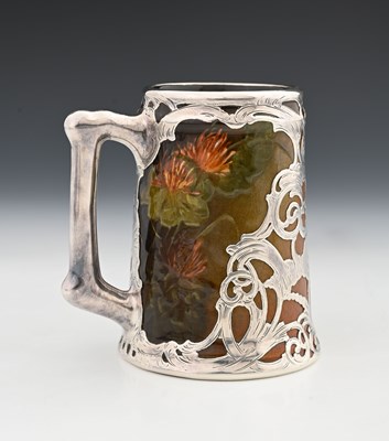 Lot 136 - A silver overlay ceramic tankard, J B Owens,...