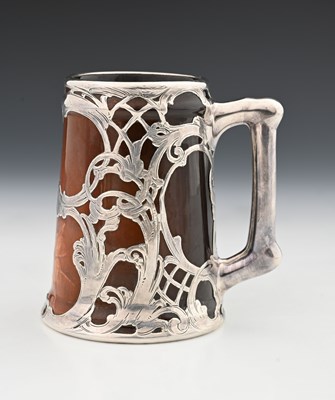 Lot 136a - A silver overlay ceramic tankard, J B Owens,...