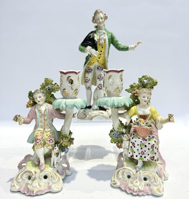 Lot 171 - A pair of Chelsea-style porcelain candle stick...