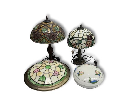 Lot 115 - Two leaded coloured glass Tiffany style lamps...