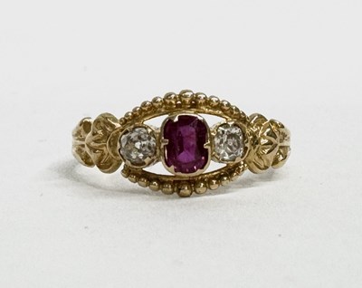 Lot 617 - A ruby and diamond three-stone ring