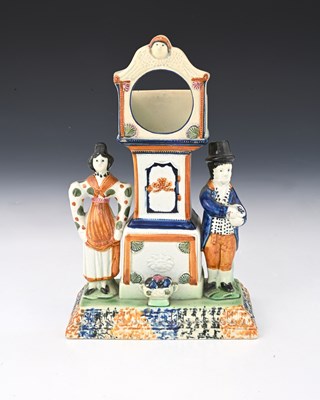 Lot 849 - A Staffordshire Prattware watch holder, circa...