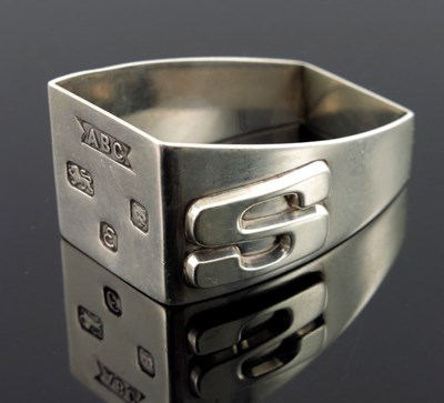 Lot 174 - A Modernist silver napkin ring, ABC, London...