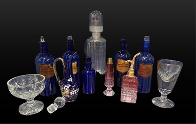 Lot 712 - Glass bottles: four 19th-century blue poison...