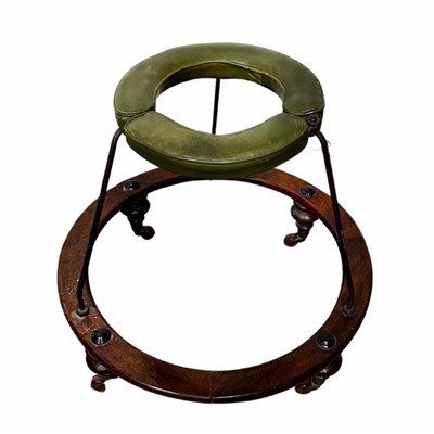 Lot 912 - A 19th century baby walker with a green...