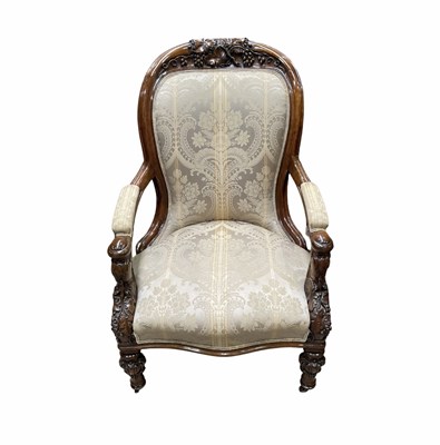 Lot 864 - A carved Victorian highback armchair of large...