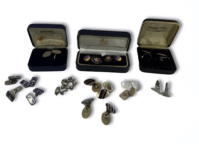 Lot 595 - A pair of silver cufflinks adapted from...