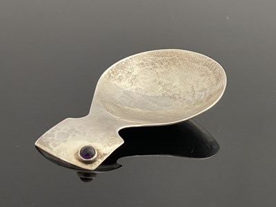 Lot 176 - A Modernist silver and gem set caddy spoon,...