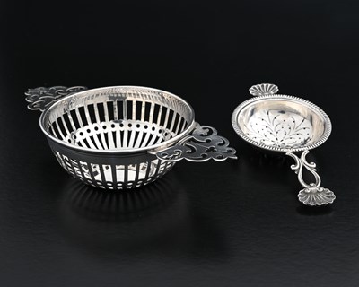 Lot 120 - An Edward VIII silver tea strainer, with...