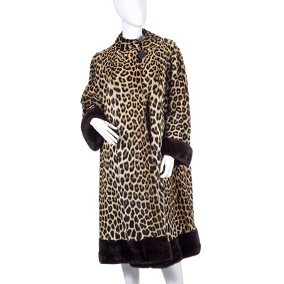 Lot 518 - Calman Links, a 1950s leopard fur coat with mink fur trim.