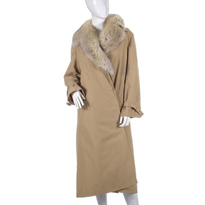 Lot 508 - A beige trench coat with removable fur lining and trim.