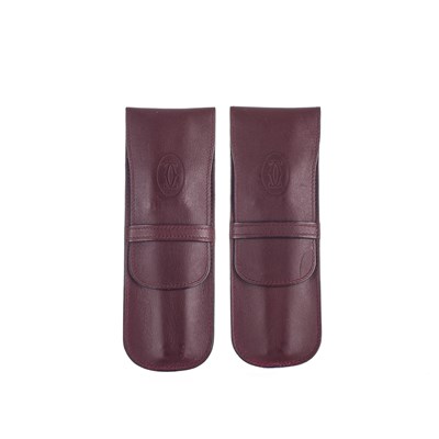 Lot 308 - Cartier, two Bordeaux leather pen cases